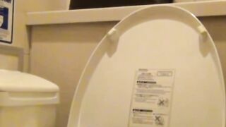 Voyeur films Japanese babe rubbing her pussy in ladies room