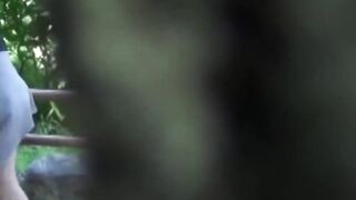 Voyeur films Asian women making puddles ina  public park