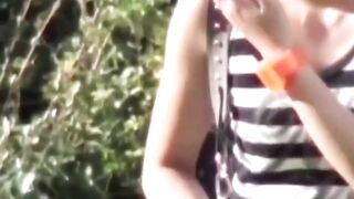 Voyeur films Asian women making puddles ina  public park