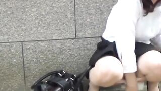 Adorable girl rushes to the park to find a spot to pee