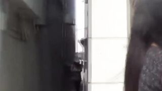 This girl seeks a spot to relief from her urge