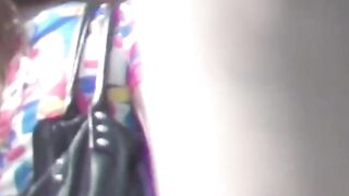 Her golden stream leaks through her panties in public corner