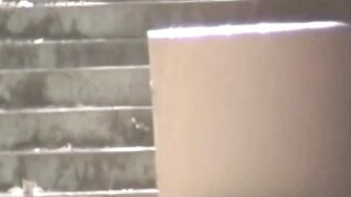 Voyeur spots babe peeing on stairs and flees in wet skirt