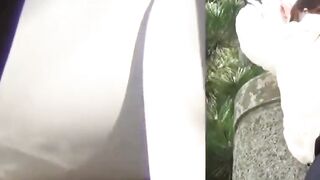 Restrained Asian girl peeing in pants unable to undress