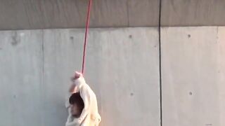 Restrained Asian babes peeing down pant legs