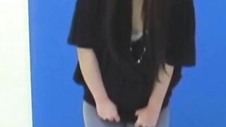 Brunette Japanese teen peeing pants after losing control