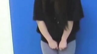 Brunette Japanese teen peeing pants after losing control