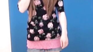 Asian amateur girl peeing in shorts during solo photoshoot
