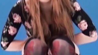 Asian amateur girl peeing in shorts during solo photoshoot