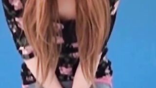 Asian amateur girl peeing in shorts during solo photoshoot