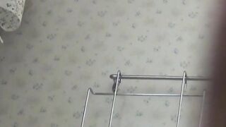 Voyeur captures Japanese girl in a heated moment at home