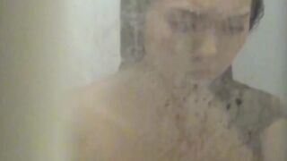Voyeur captures Japanese girl in a heated moment at home