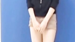 Kinky Asian brunette soaking clothes during photoshoot