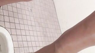 Hidden cam records Japanese women pissing in a restroom