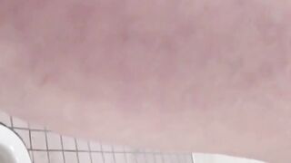 Hidden cam records Japanese women pissing in a restroom
