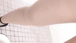 Hidden cam records Japanese women pissing in a restroom