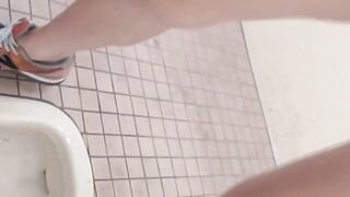 Hidden cam records Japanese women pissing in a restroom