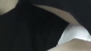 Japanese woman unknowing as she entertains herself on tape