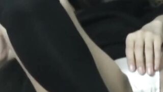 Japanese woman unknowing as she entertains herself on tape