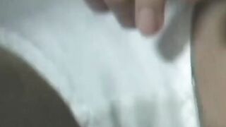 Japanese woman unknowing as she entertains herself on tape
