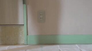 Petite Japanese girl rubs her pussy before warm peeing shower