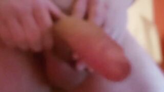 Young stud wanking off his mega cock in closeup