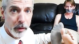 Professor Lennox tickles the feet of his student Jessie Russel through his stinky soc