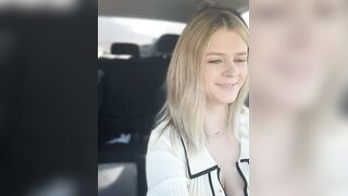 Sexy blonde bombshell teasing you with her cleavage baring outfit