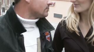 Denisa Heaven strokes cock to spray jizz on her body in the hallway