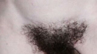 Close-Up Of A Bushy Amateur Pussy