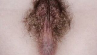 Close-Up Of A Bushy Amateur Pussy