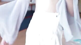 Blonde Step Sister Ava Taylor Sits on Bed in Teal Outfit and White Tights