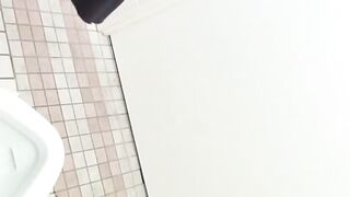Voyeur Captures Cute Japanese Brunette Peeing in Bathroom