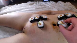 Nyotaimori (女 小 盛 り "serving on a Woman's Body")