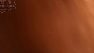 Stunning Redhead Shemale Teases with Big Black Dildo in Green Sweater