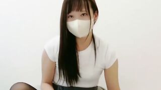 Nozomi Masturbates in Black Pantyhose and Face Mask