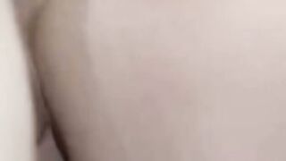 Brunette Office Secretary on Phone Call in White Blouse