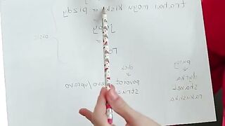 Blonde Teacher Explains Lesson with Pencil and Whiteboard