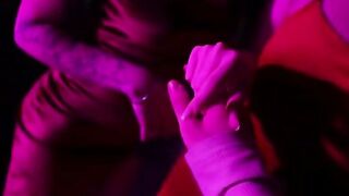 Tattooed Couple Intimate in Red Dress Under Neon Lights