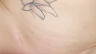 Blonde Woman with Lip Piercing and Butterfly Tattoo in the Shower