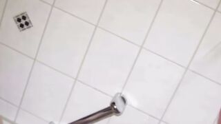 Blonde Woman with Lip Piercing and Butterfly Tattoo in the Shower