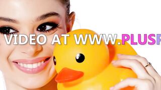 Blonde in Yellow Bikini Poses with Rubber Duck and Inflatable Toy