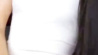 Brunette Model Teases in Tight White Bodysuit