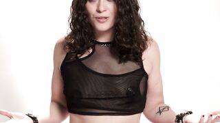 Brunette with Curly Hair Wearing Black Mesh Top and Choker