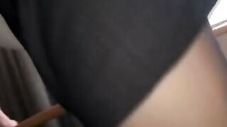 Smiling Japanese Woman in Black Blouse Touching Neck