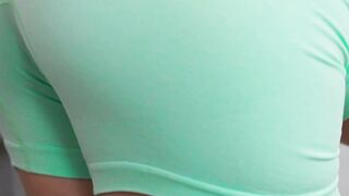 Busty Blonde in Green Outfit Wipes Counter While Bearded Guy Watches