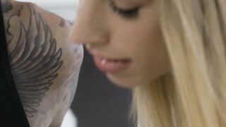 Blonde Girl Gets Intimate with Tattooed Guitarist in Bedroom Scene