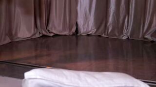 Bedroom Scene with White Pillow and Brown Curtains