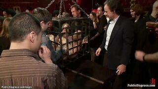 Blindfolded slaves tied inside metal box